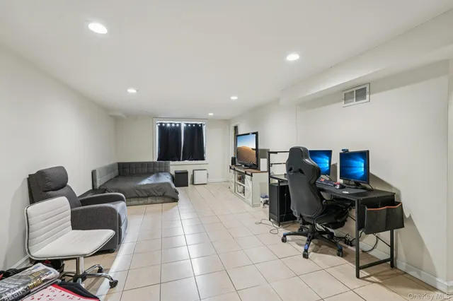 a view of a workspace with furniture and a couch