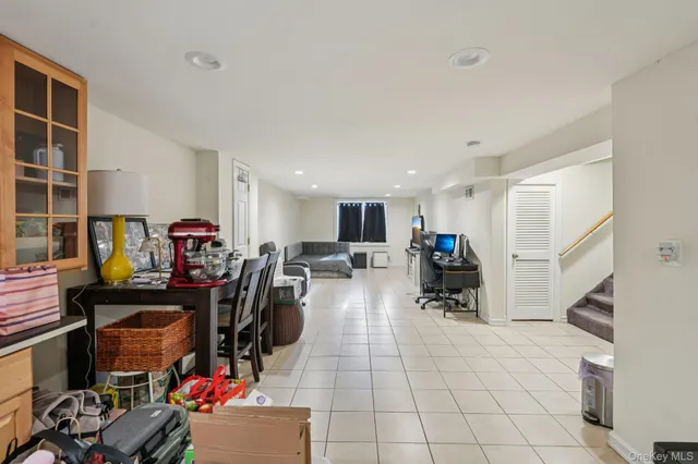 a view of a yard with wooden fence