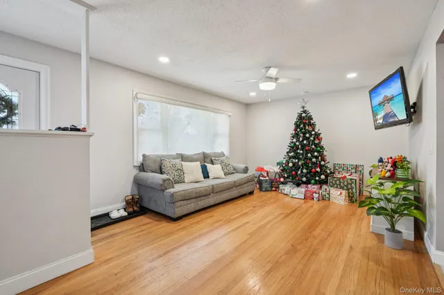 a living room with furniture and a christmas tree