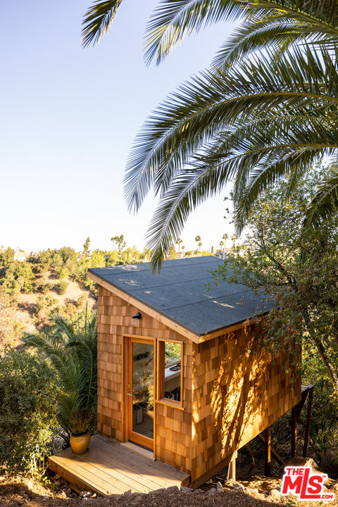 4610 Rising Hill Road Altadena, CA 91001 - Photo 21 of 26 a view of a house with a yard