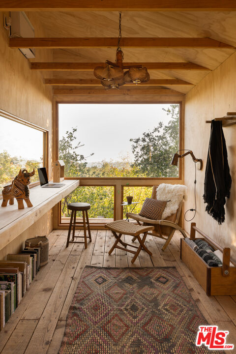 4610 Rising Hill Road Altadena, CA 91001 - Photo 23 of 26 a living room with furniture and a floor to ceiling window
