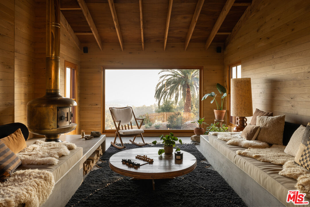 4610 Rising Hill Road Altadena, CA 91001 - Photo 4 of 26 a living room with furniture and a fireplace