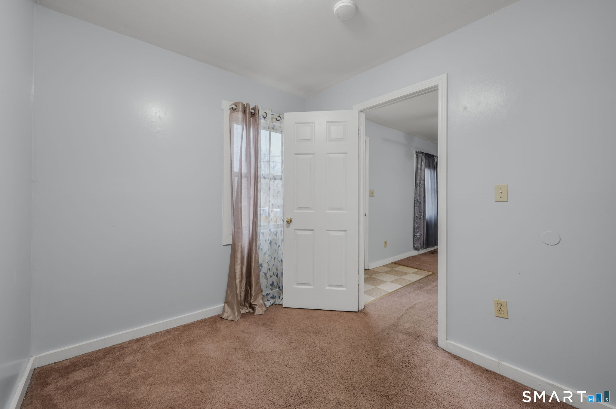 275 Midway Ovl Groton, CT 06340 - Photo 12 of 21 an empty room with closet and mirror