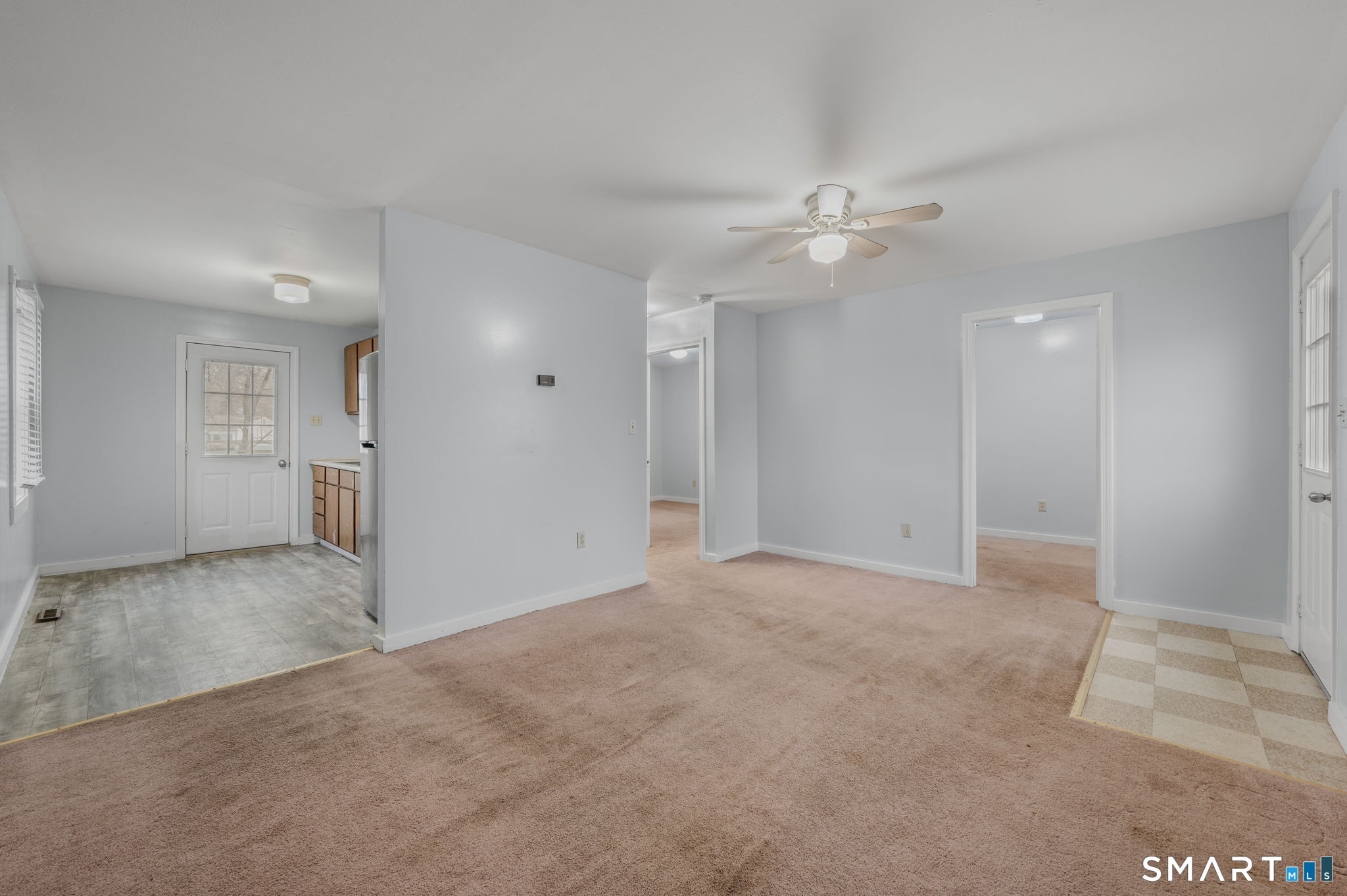 275 Midway Ovl Groton, CT 06340 - Photo 5 of 21 an empty room with a ceiling fan and a bathroom