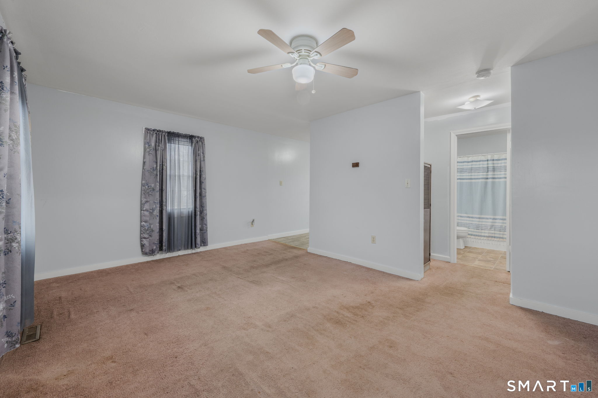 275 Midway Ovl Groton, CT 06340 - Photo 7 of 21 a view of an empty room with a ceiling fan