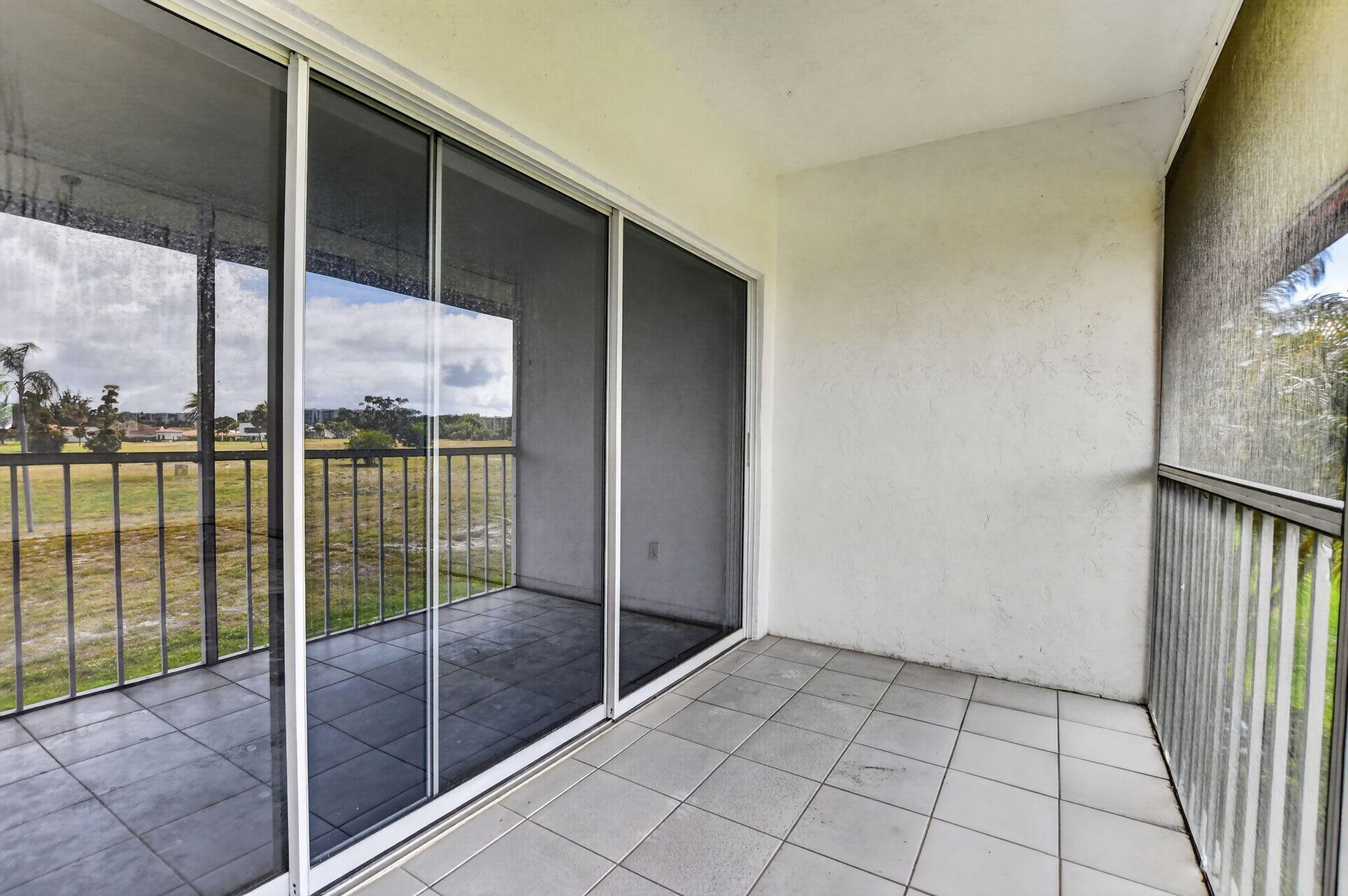 280 Northwest 67th Street, Unit B203 Boca Raton, FL 33487 - Photo 15 of 16 Rear Balcony