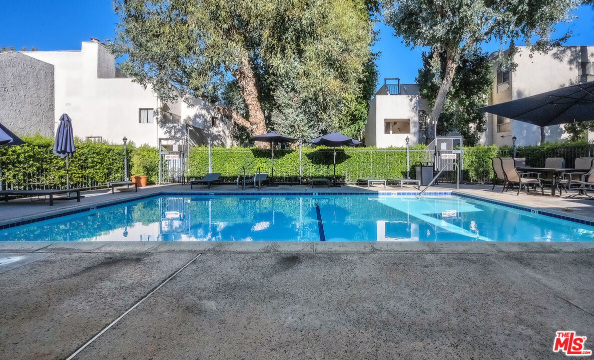18411 Hatteras Street, Unit 114 Tarzana, CA 91356 - Photo 12 of 19 a view of swimming pool