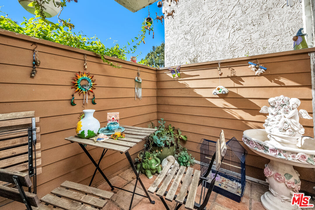 18411 Hatteras Street, Unit 114 Tarzana, CA 91356 - Photo 8 of 19 a outdoor view with a seating space