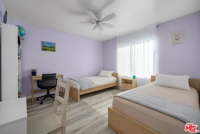 a bedroom with a bed and a couch