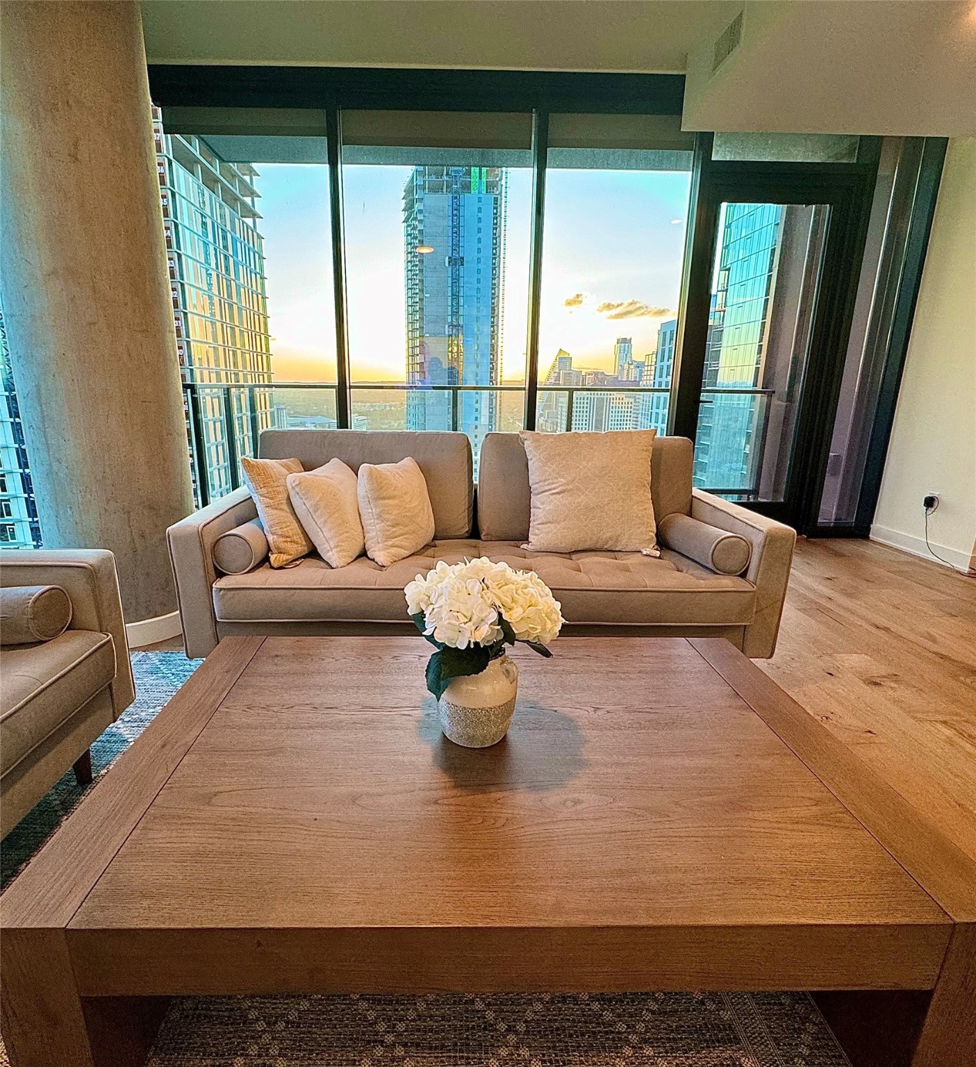 84 East Avenue, Unit 3009 Austin, TX 78701 - Photo 11 of 39 a living room with furniture and a large window