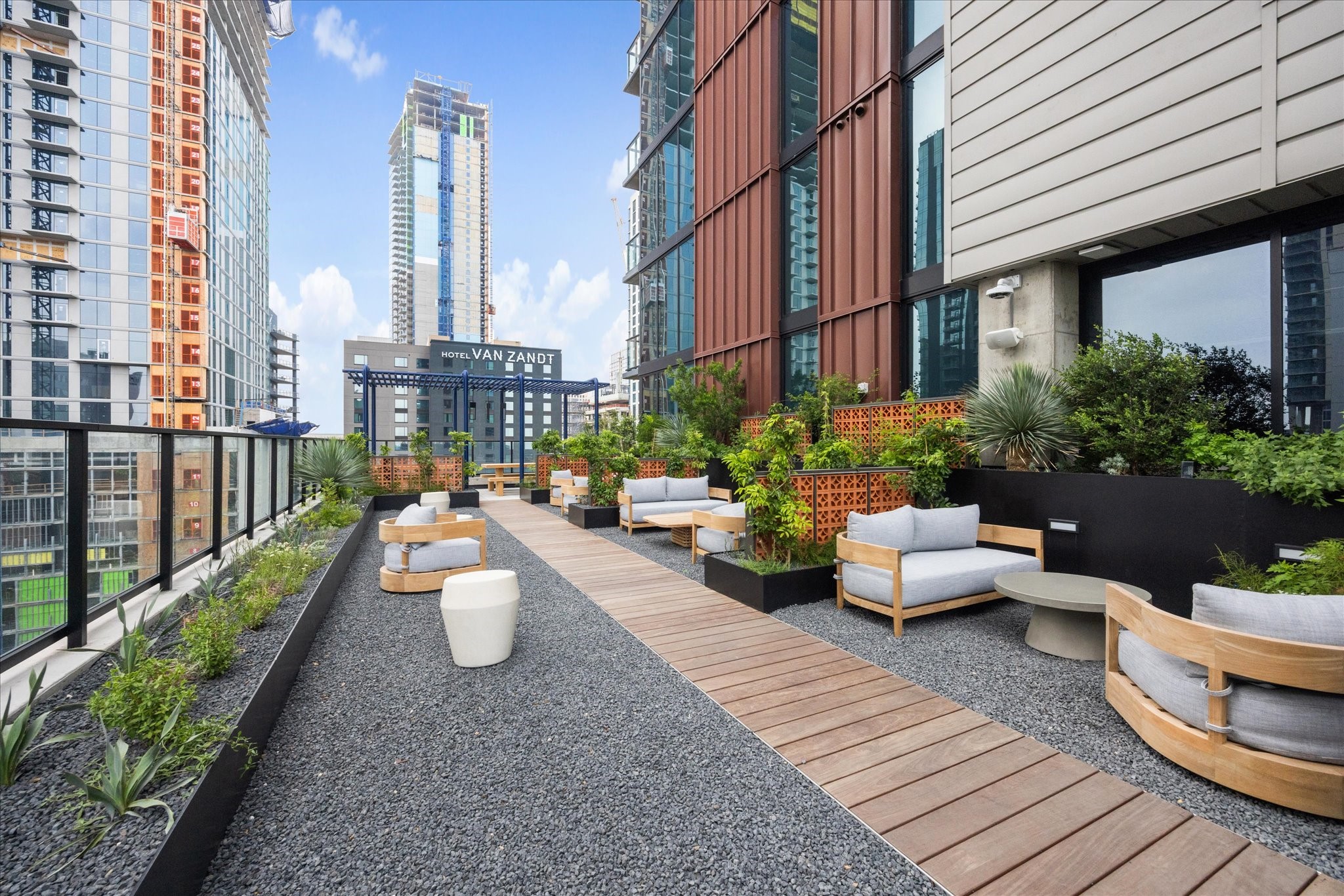 84 East Avenue, Unit 3009 Austin, TX 78701 - Photo 21 of 39 a view of a patio with couches and potted plants