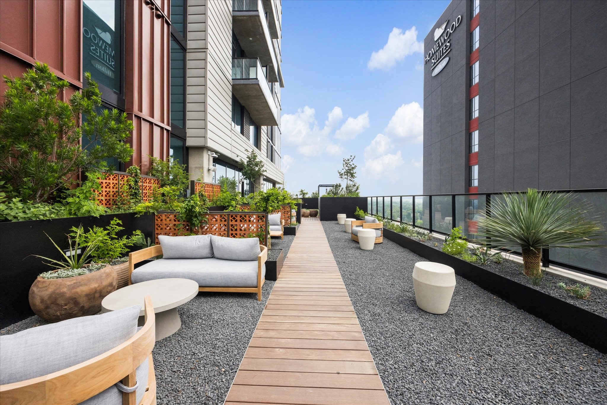 84 East Avenue, Unit 3009 Austin, TX 78701 - Photo 22 of 39 a view of a patio with couches and potted plants