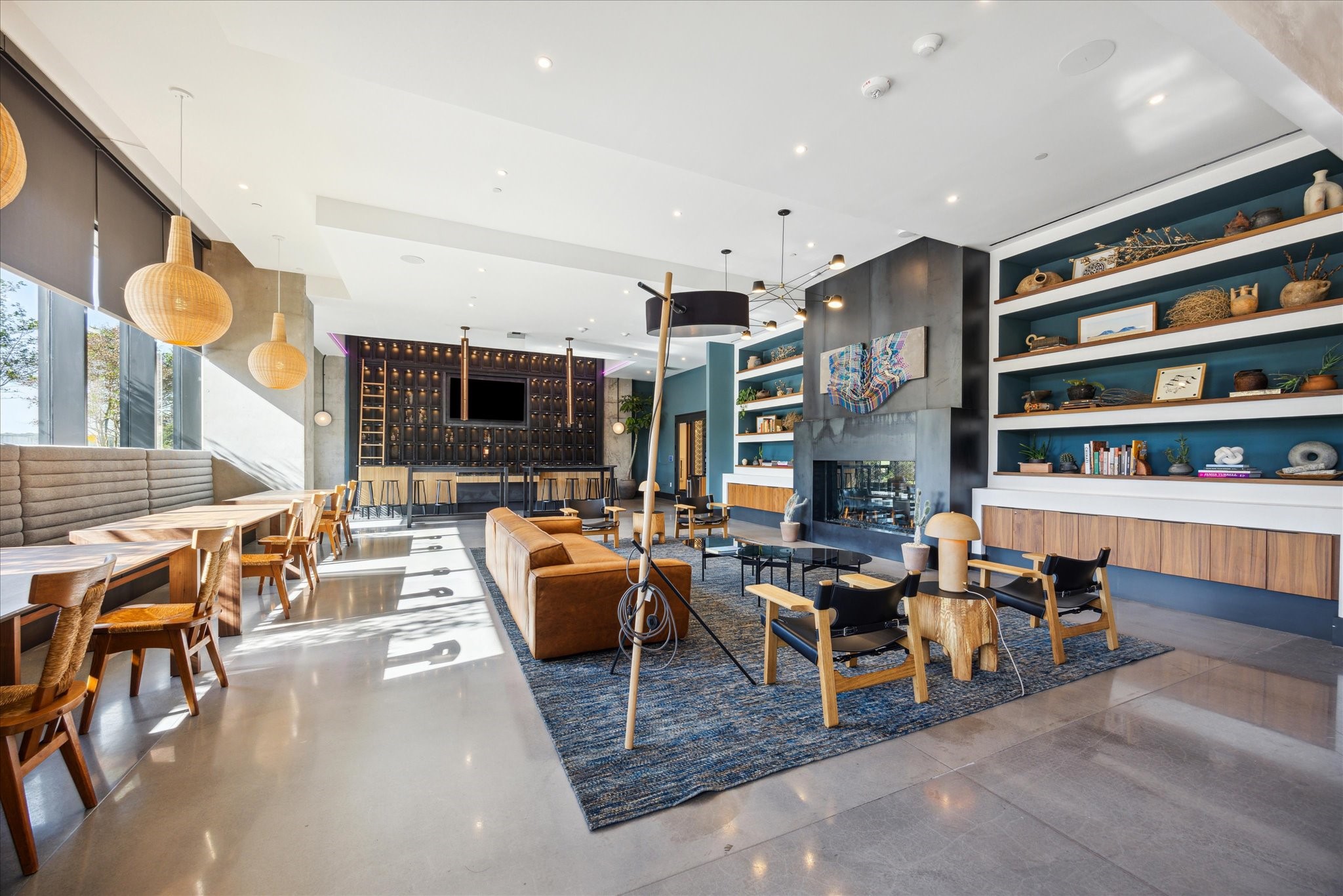 84 East Avenue, Unit 3009 Austin, TX 78701 - Photo 28 of 39 a living room with fireplace furniture and a large window