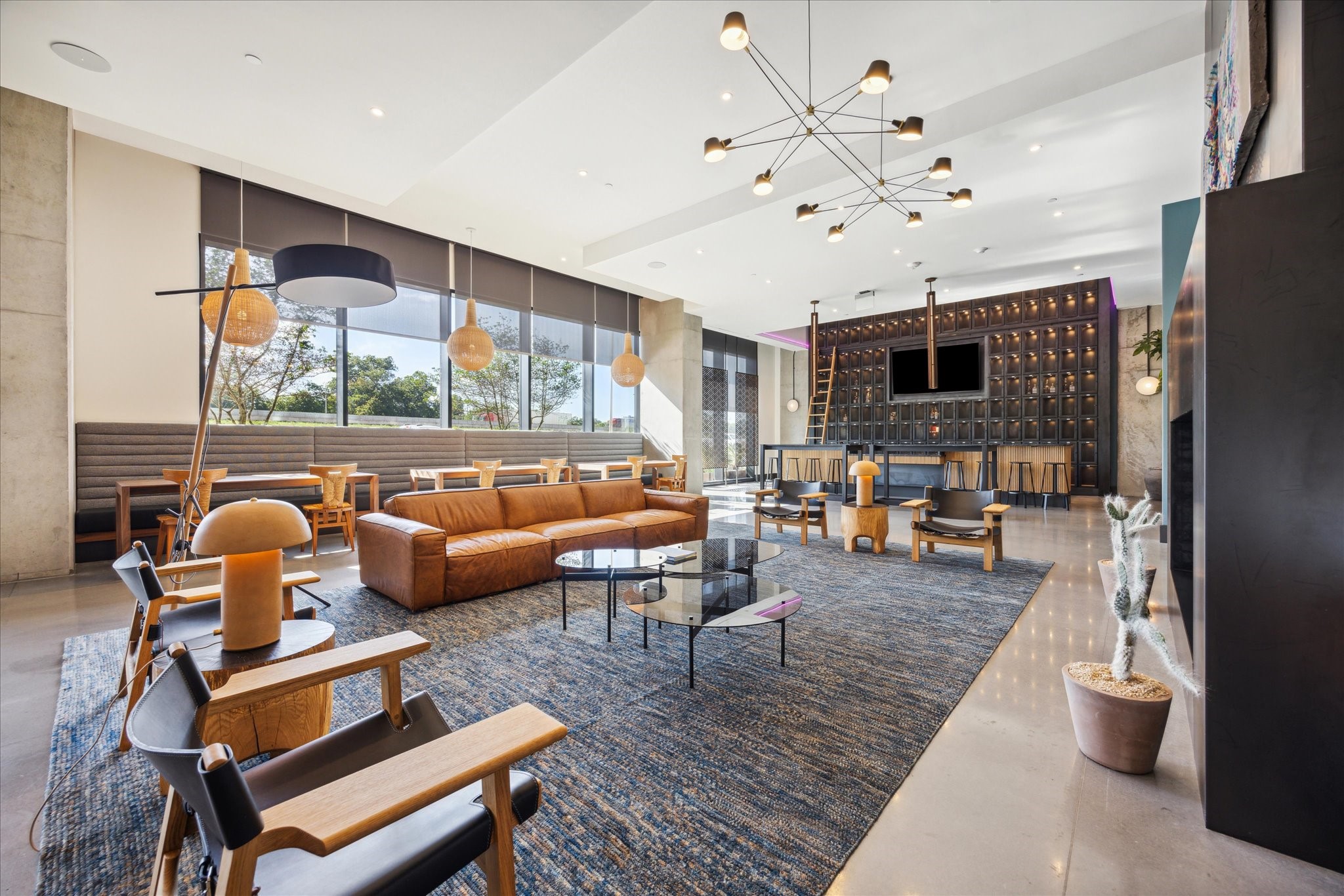 84 East Avenue, Unit 3009 Austin, TX 78701 - Photo 29 of 39 a living room with furniture fireplace and a flat screen tv