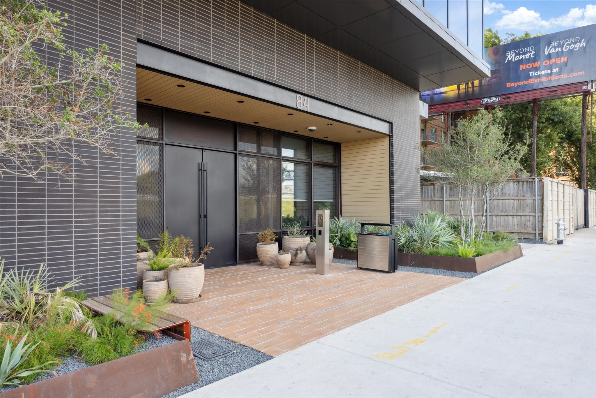 84 East Avenue, Unit 3009 Austin, TX 78701 - Photo 36 of 39 a view of a chair and table in the patio with potted plants