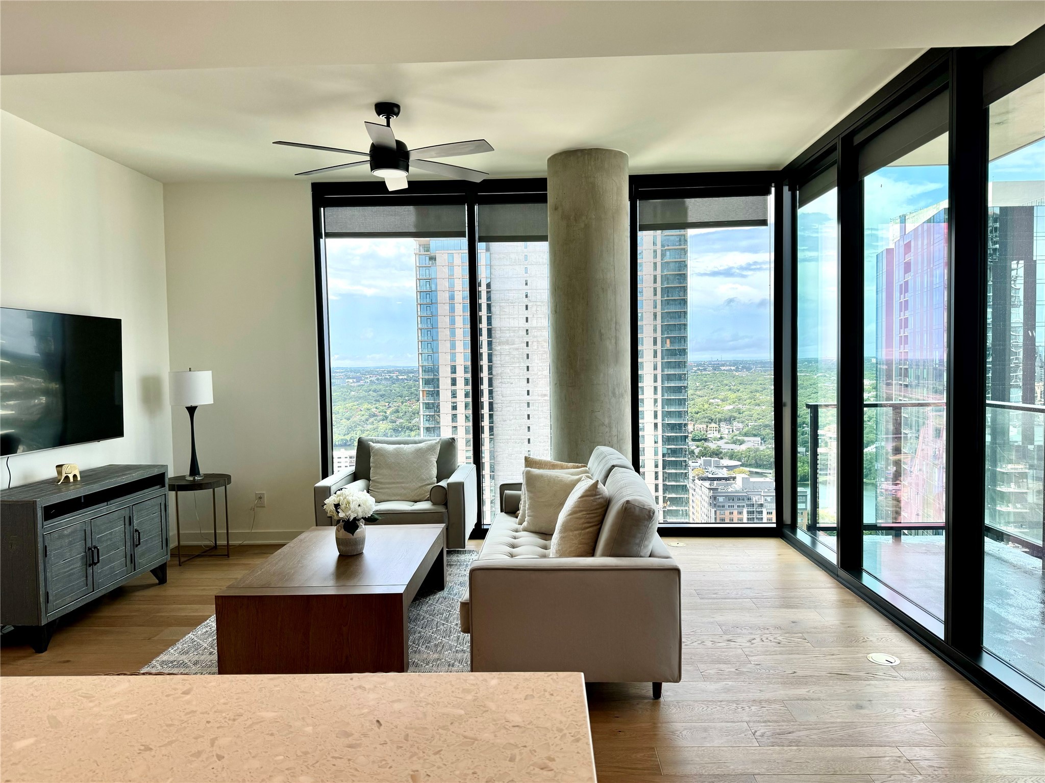 84 East Avenue, Unit 3009 Austin, TX 78701 - Photo 7 of 39 a living room with furniture and large windows