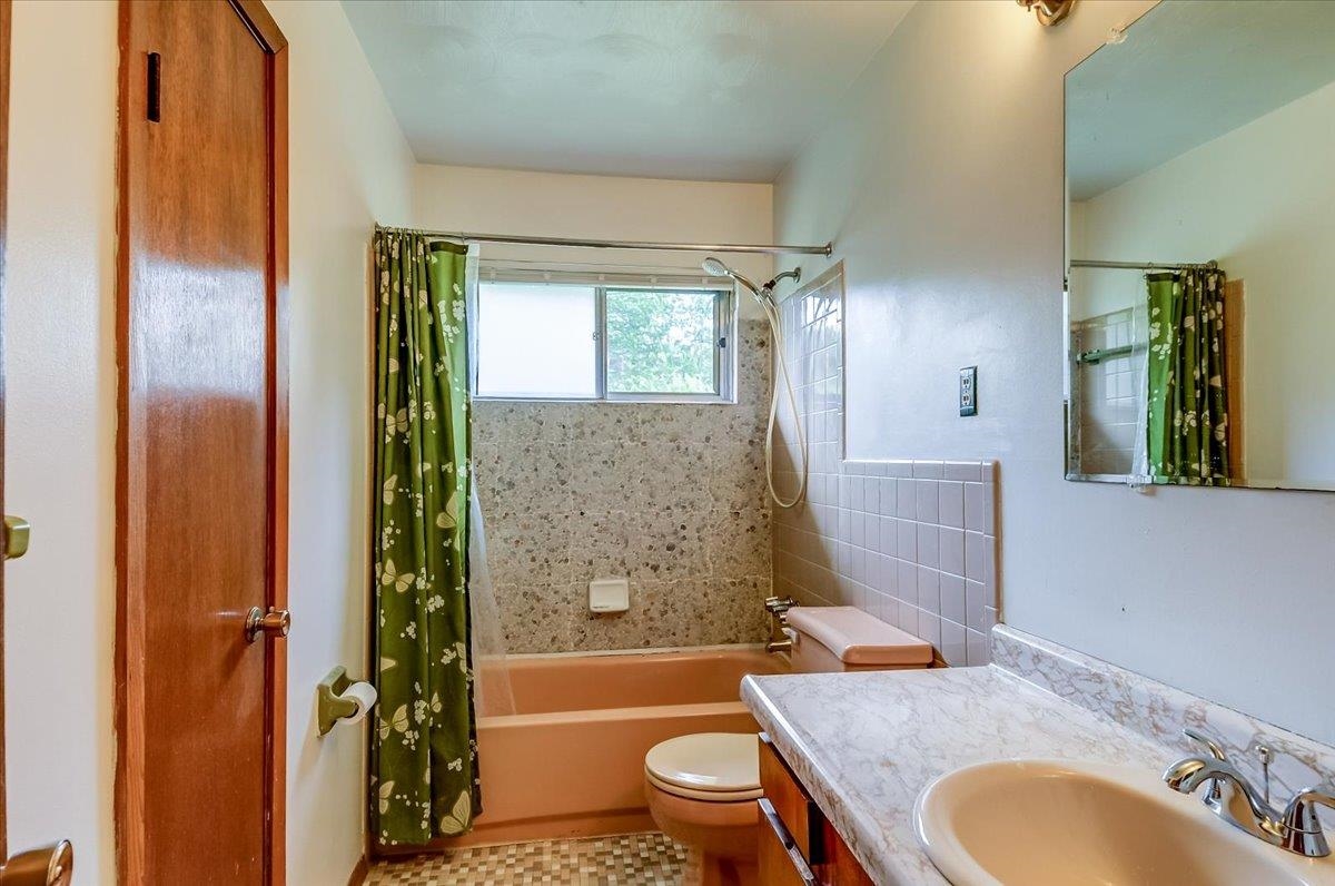 2569 Rozelle Street Memphis, TN 38114 - Photo 20 of 30 Bathroom featuring a built-in vanity with a countertop, an integrated sink, and a chrome faucet