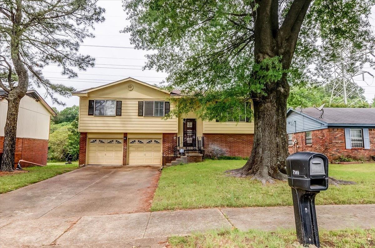 2569 Rozelle Street Memphis, TN 38114 - Photo 2 of 30 Split-level residence featuring a brick and siding exterior