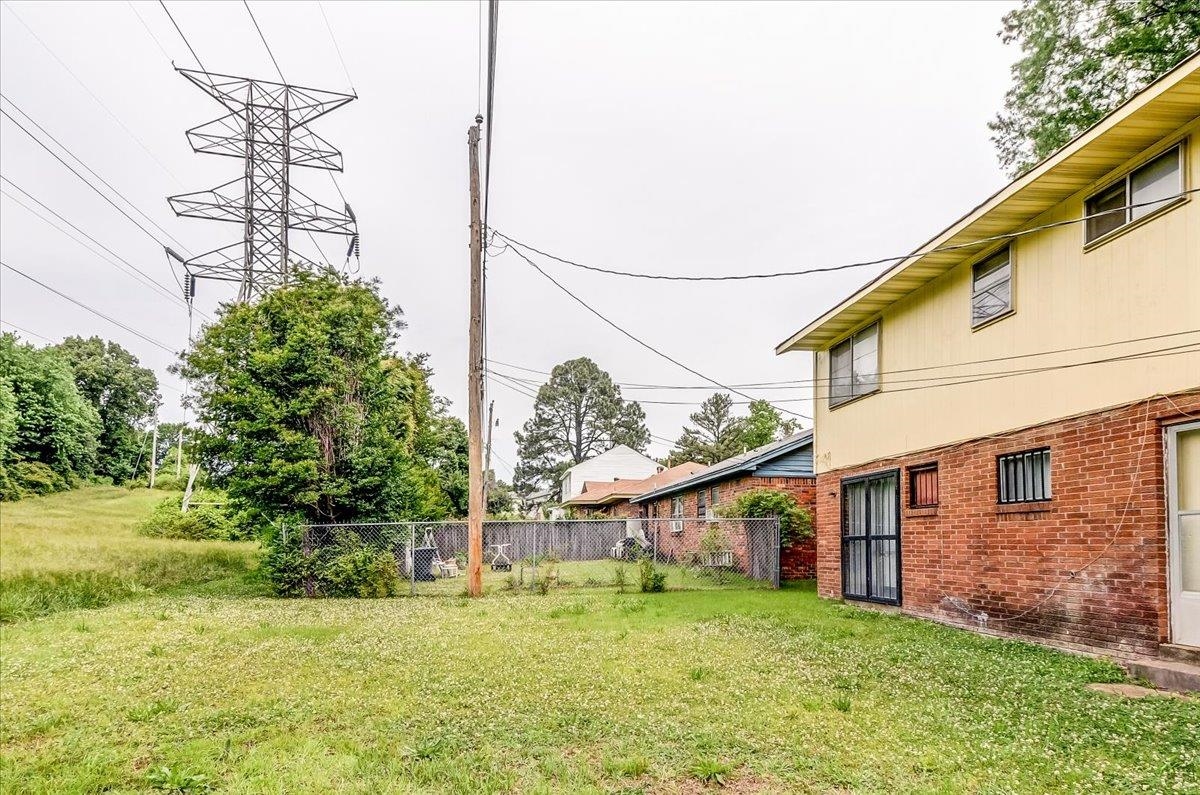 2569 Rozelle Street Memphis, TN 38114 - Photo 27 of 30 Rear exterior featuring a brick lower level and painted siding upper level