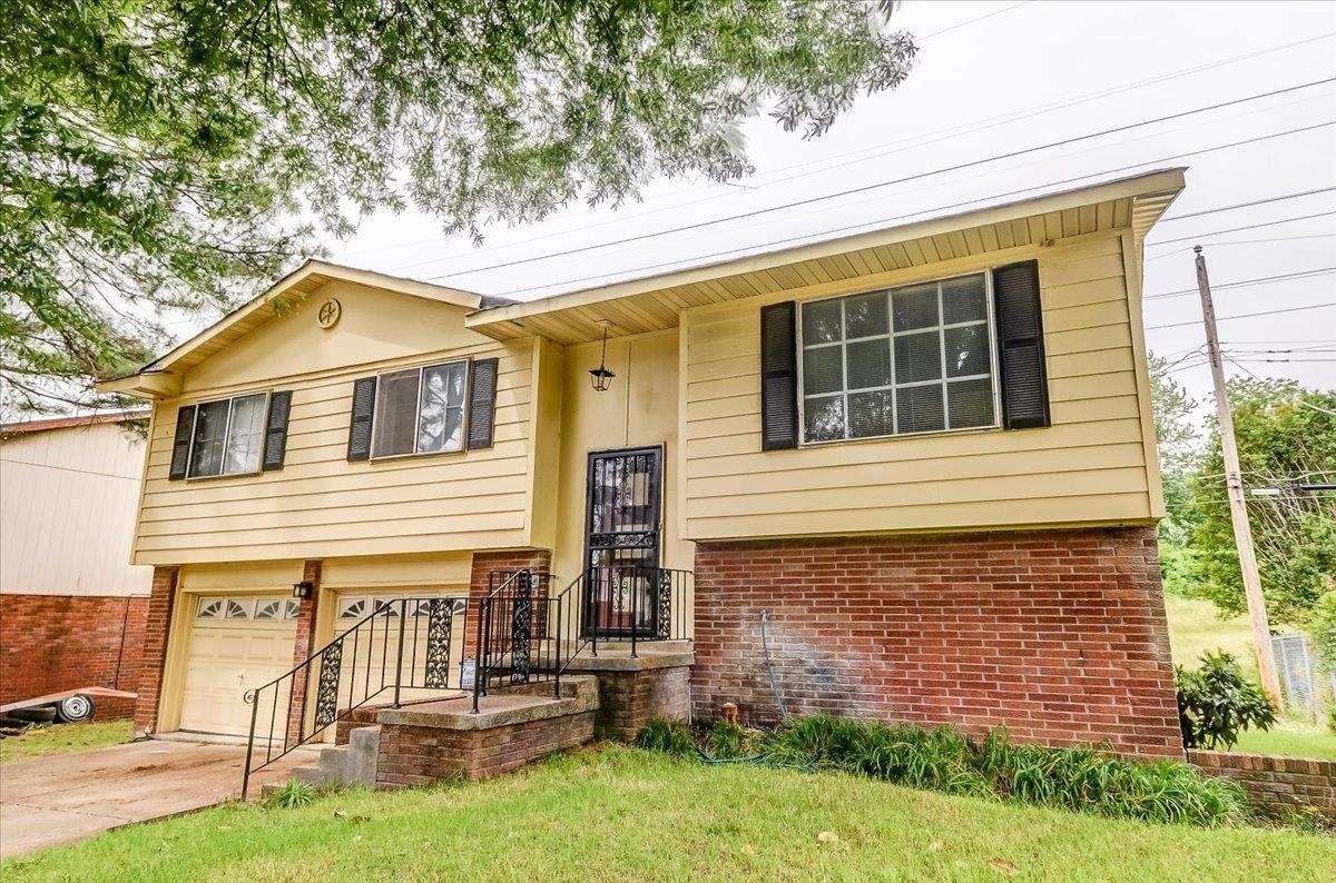 2569 Rozelle Street Memphis, TN 38114 - Photo 4 of 30 Split-level residence featuring a brick and siding exterior