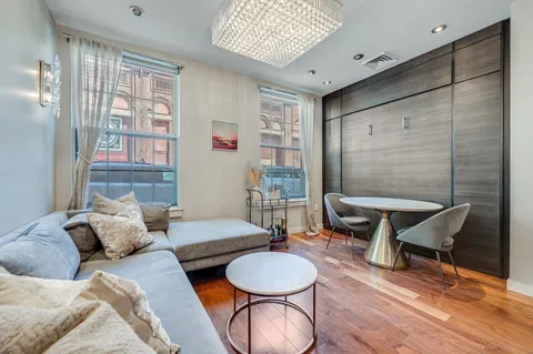 a living room with furniture and a window