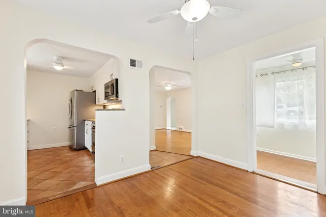 a view of a kitchen with wooden floor