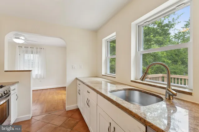 a kitchen with a sink and a window