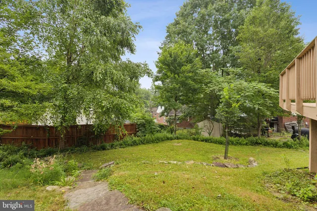 a view of backyard with green space
