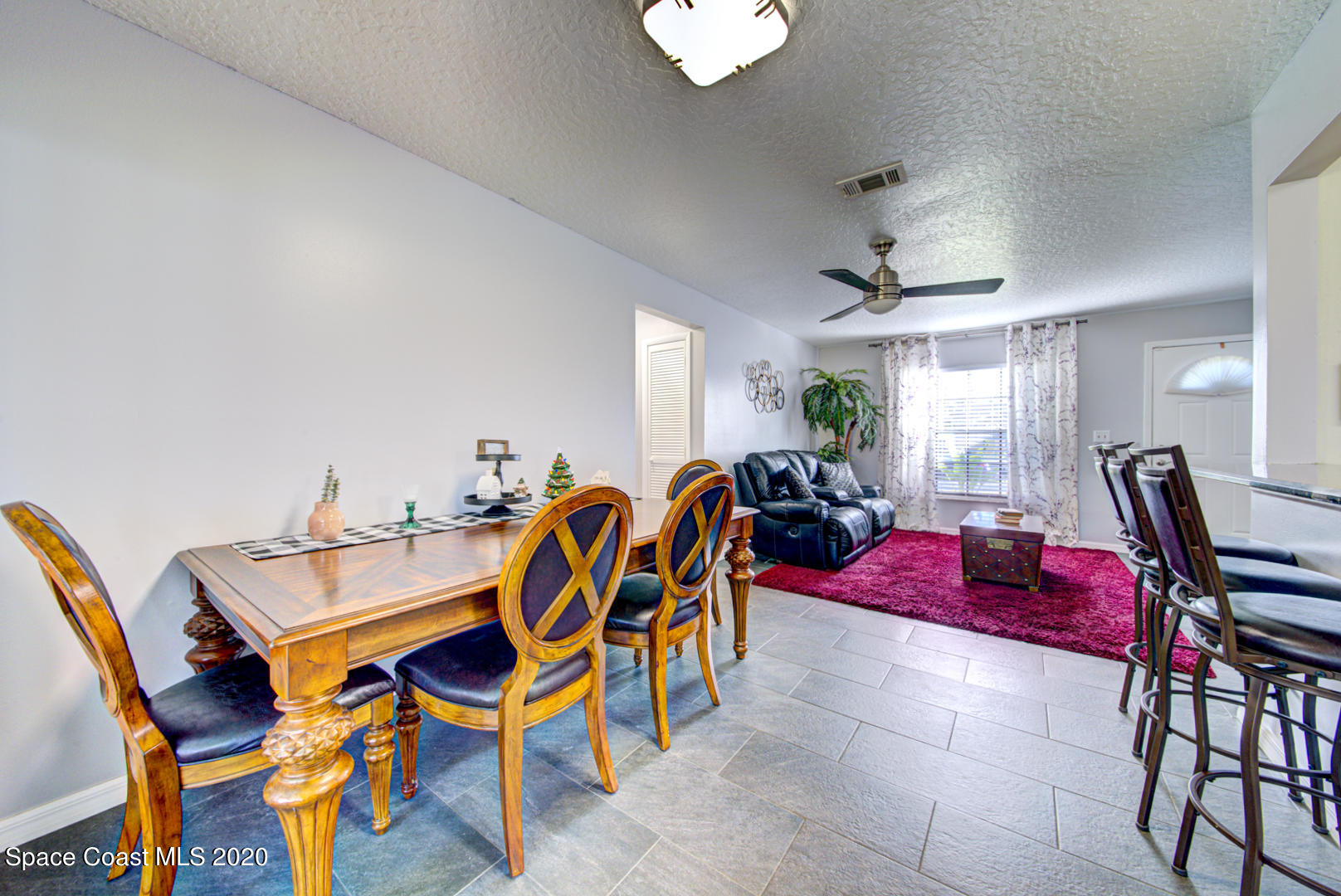 5130 Holden Road Cocoa, FL 32927 - Photo 12 of 49 dining room open to living room