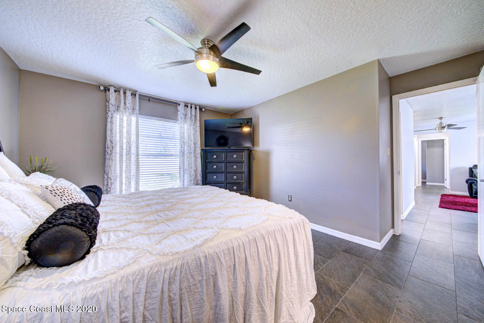 5130 Holden Road Cocoa, FL 32927 - Photo 21 of 49 master bedroom with tile floor