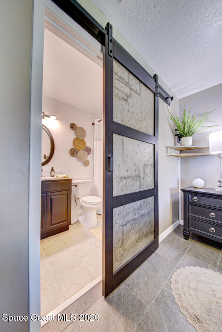 5130 Holden Road Cocoa, FL 32927 - Photo 23 of 49 master bedroom barn door