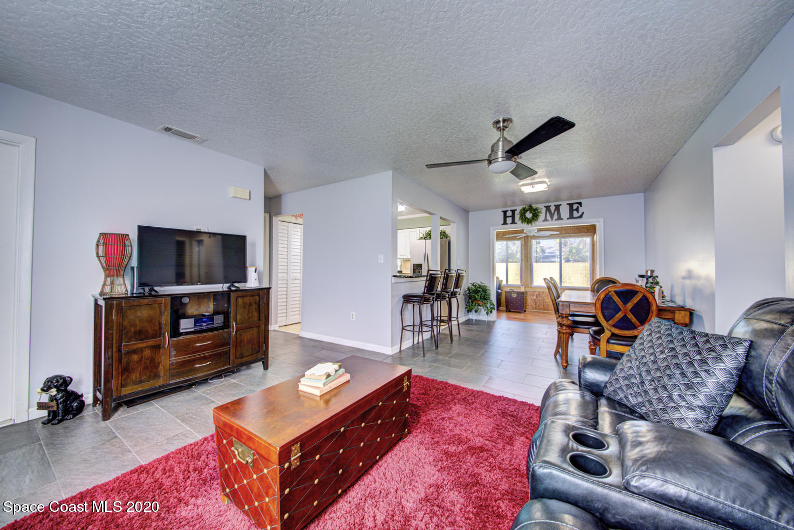 5130 Holden Road Cocoa, FL 32927 - Photo 10 of 49 living room open to dining room
