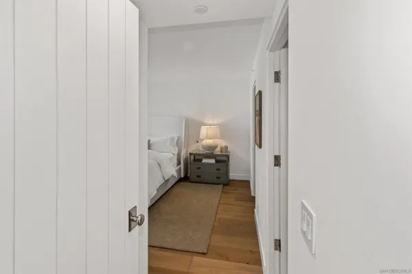 a view of a room that has a bed in it