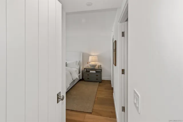 a view of a room that has a bed in it