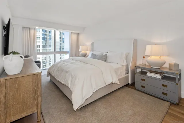 a bedroom with a bed and window