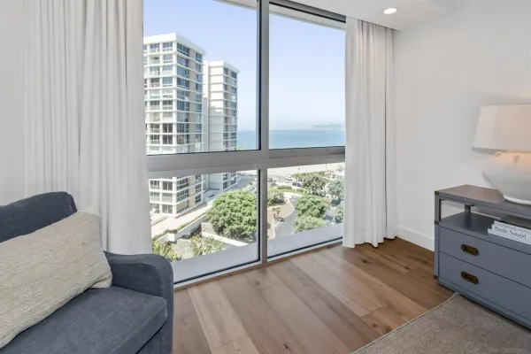 a bedroom with furniture and a window