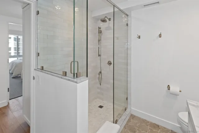 a bathroom with a shower and a sink