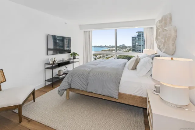 a bedroom with a bed and a windows