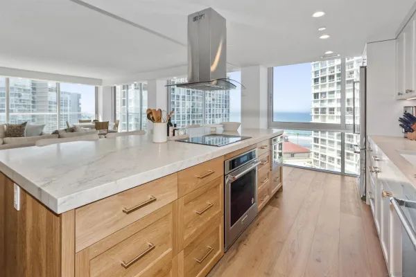 a kitchen with stainless steel appliances granite countertop a stove and a sink