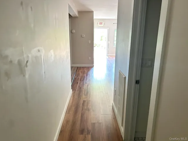 a view of a bathroom from the hallway