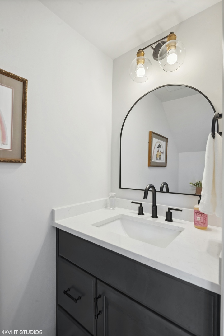 853 Seminary Circle Glen Ellyn, IL 60137 - Photo 13 of 26 a bathroom with a sink and a mirror