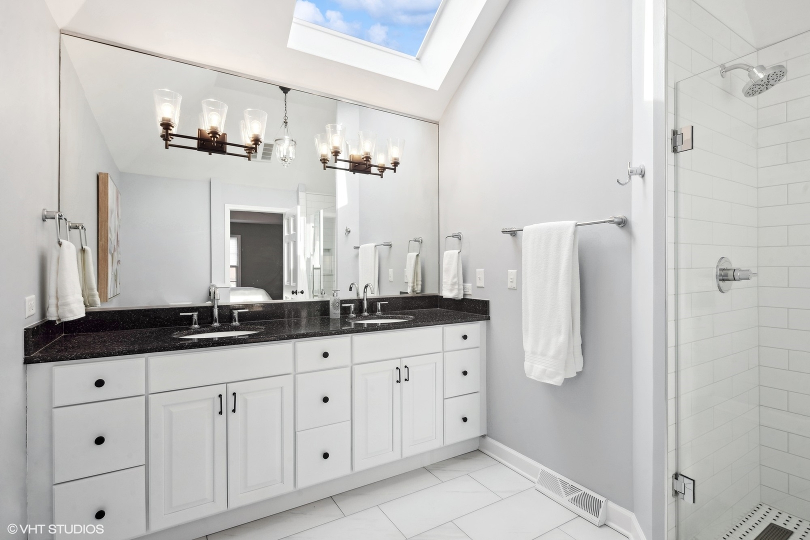 853 Seminary Circle Glen Ellyn, IL 60137 - Photo 19 of 26 a bathroom with a double vanity sink and a mirror