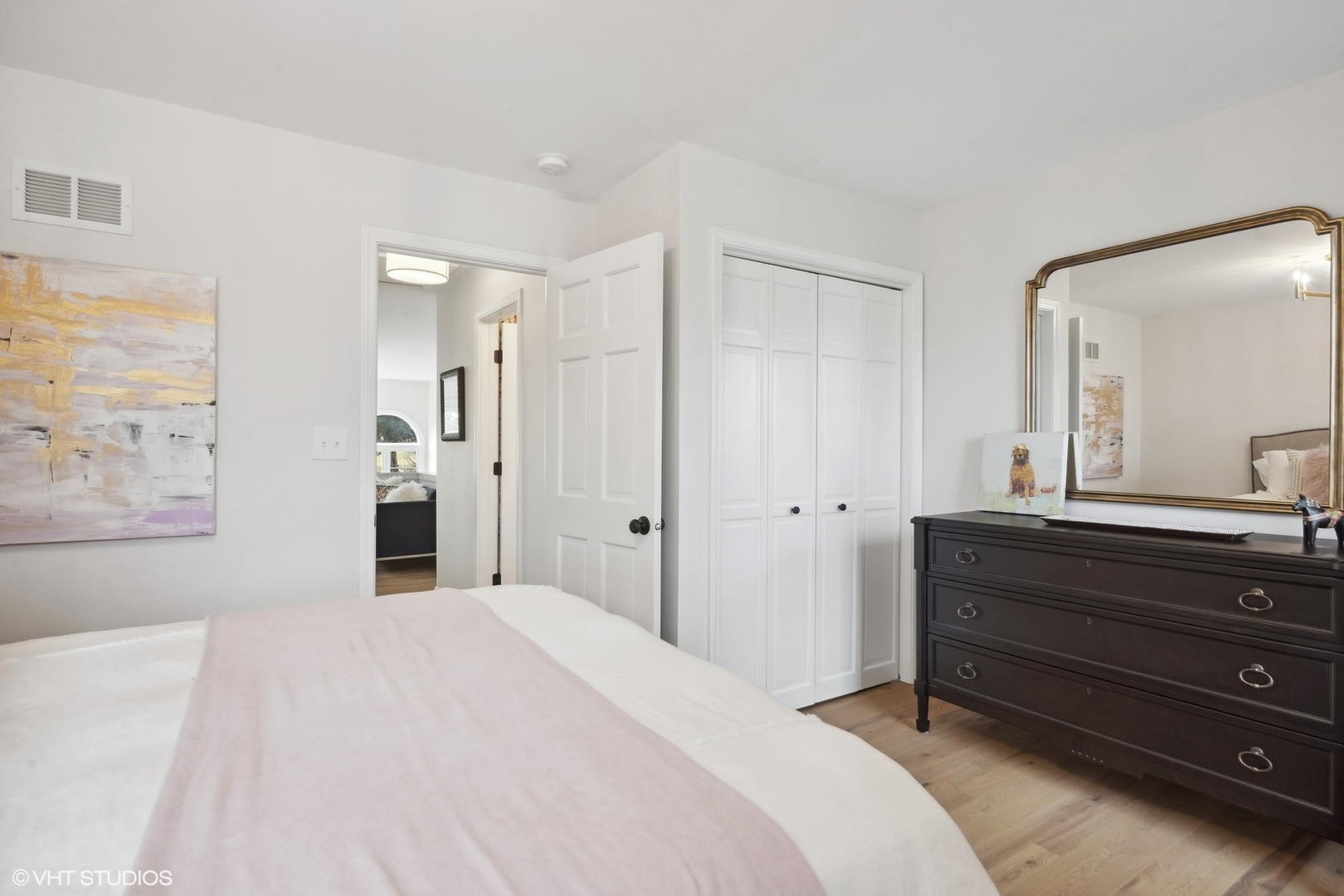 853 Seminary Circle Glen Ellyn, IL 60137 - Photo 22 of 26 a spacious bedroom with a bed and a mirror