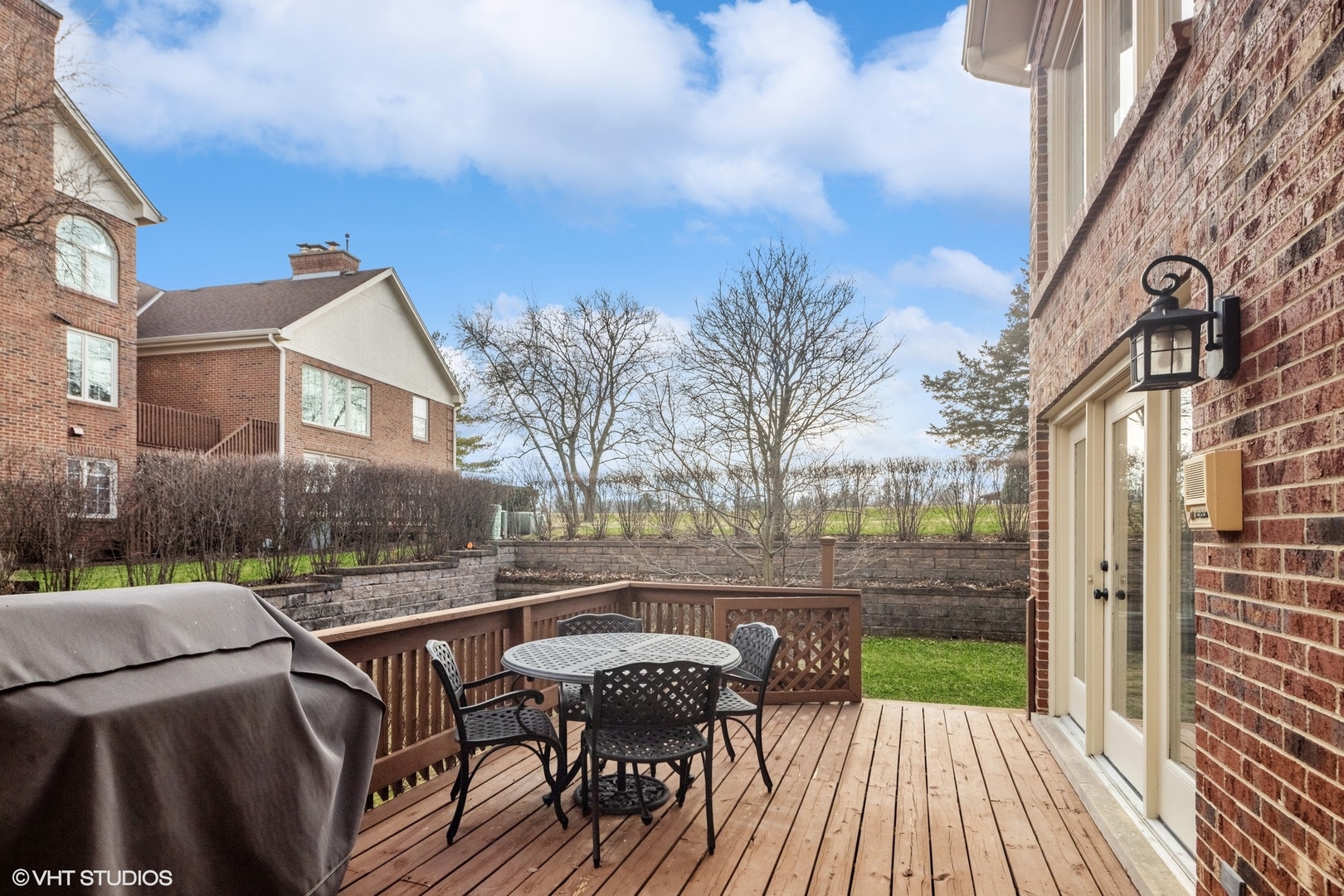 853 Seminary Circle Glen Ellyn, IL 60137 - Photo 26 of 26 a view of a patio with couches table and chairs and wooden floor