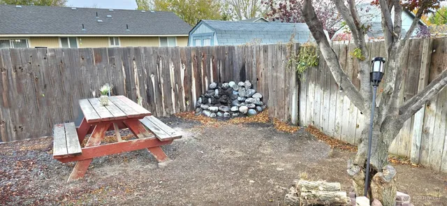 a wooden bench sitting in front of a house