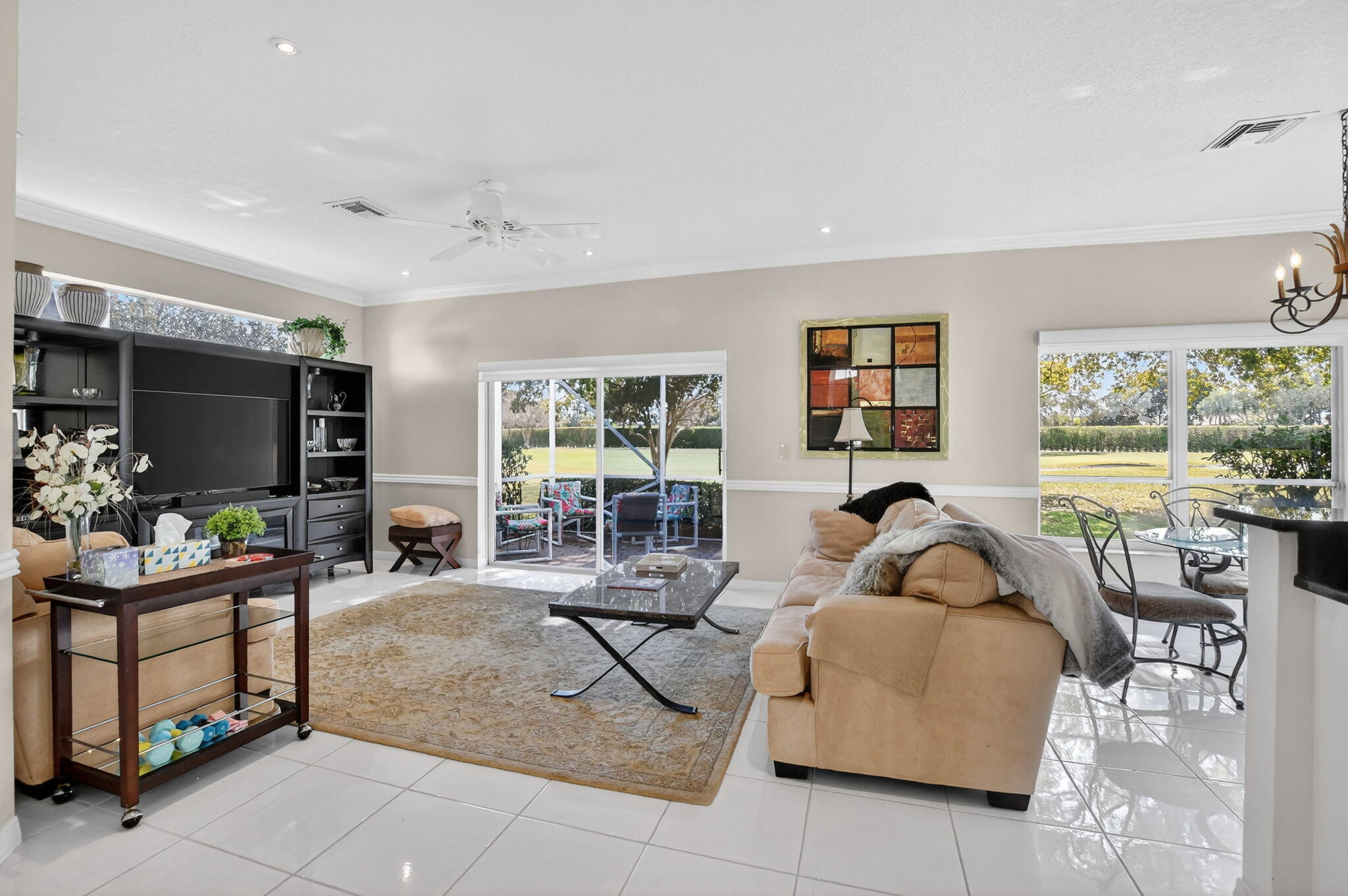 7323 Panache Way Boca Raton, FL 33433 - Photo 11 of 46 a living room with furniture a flat screen tv and a large window