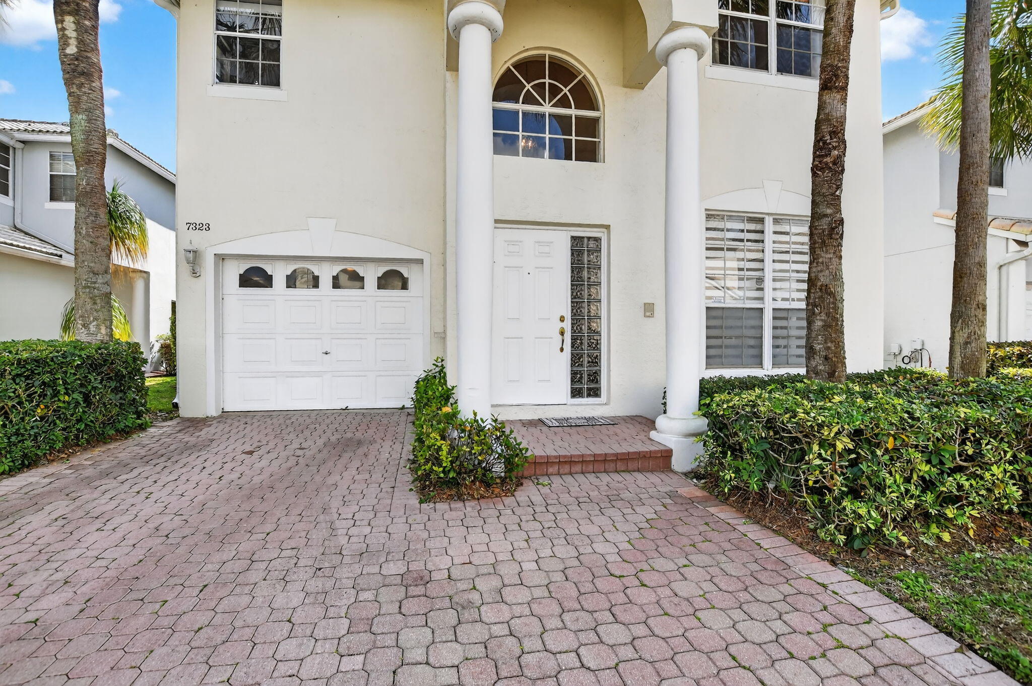 7323 Panache Way Boca Raton, FL 33433 - Photo 2 of 46 a front view of a house with a yard