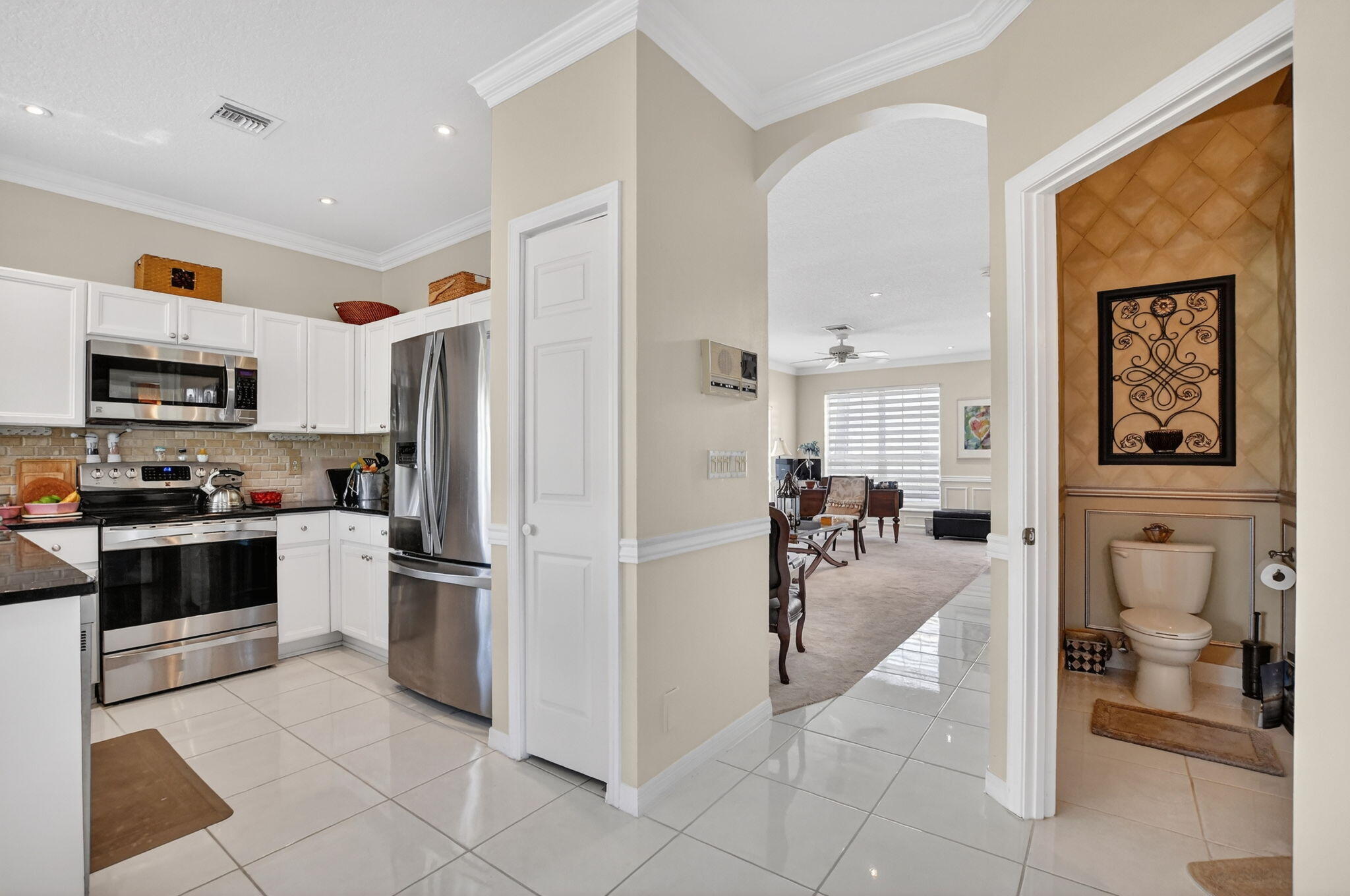 7323 Panache Way Boca Raton, FL 33433 - Photo 23 of 46 a view of a living room kitchen and a stove top oven