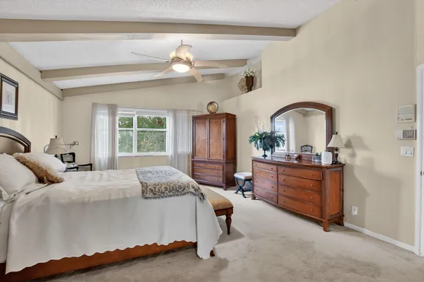 a bed room with a bed and a dresser