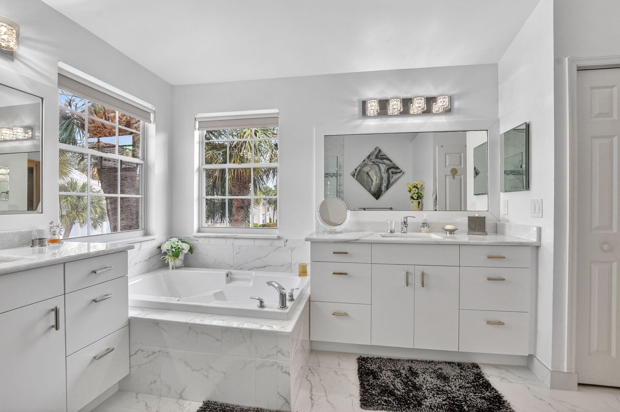 7323 Panache Way Boca Raton, FL 33433 - Photo 30 of 46 a bathroom with a granite countertop tub sink a mirror and next to a window